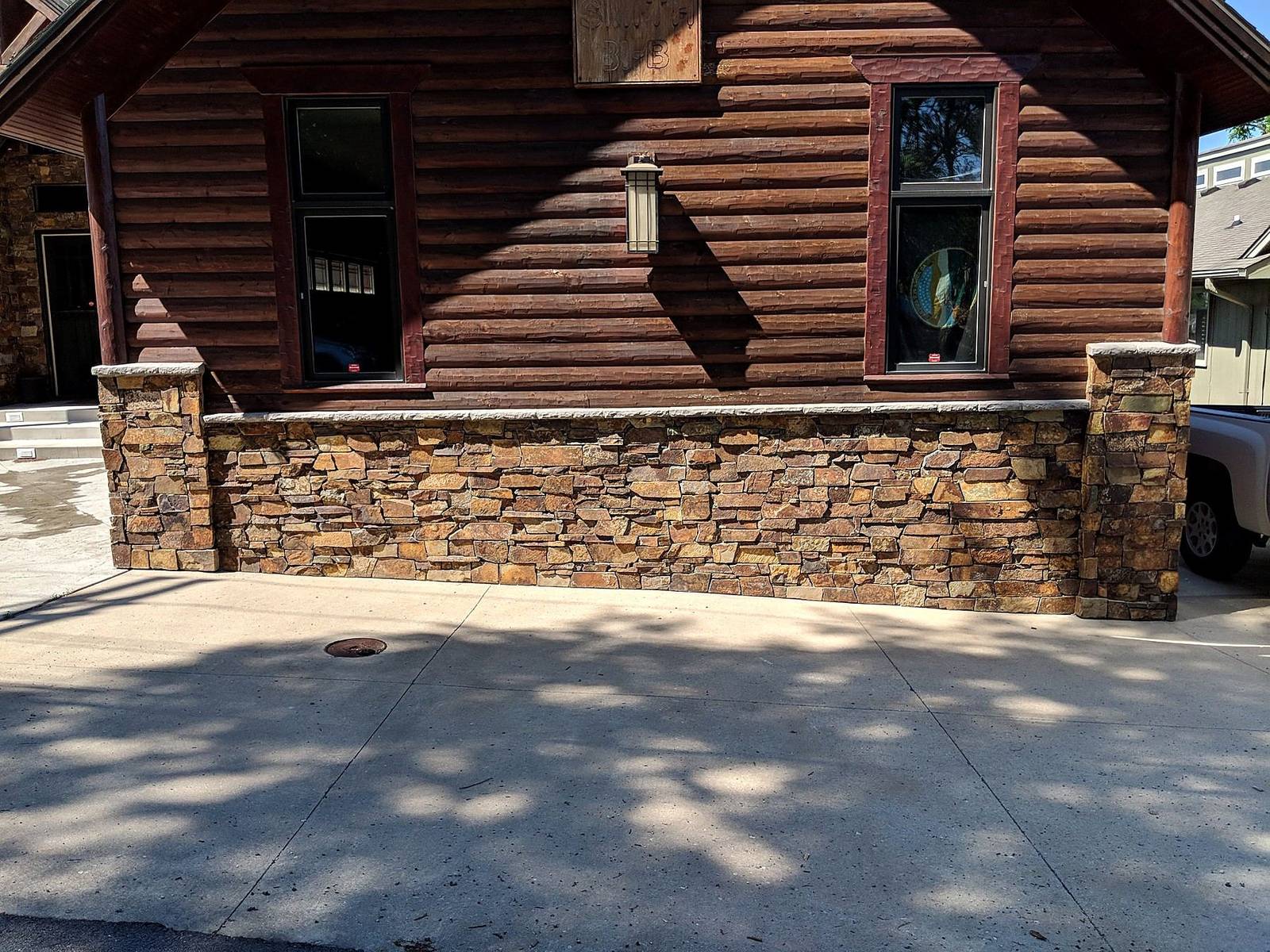 Stone wainscot and piers, cabin